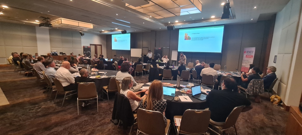 First Nations Native Food Blockchain Workshop. Attendees seated around tables in conference room listening to keynote speaker