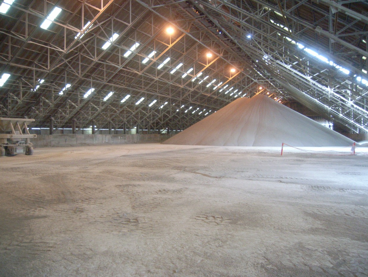 Image of bulk fertiliser in a storage shed.