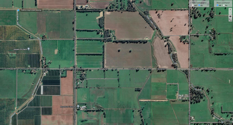 Example from Navigating Farm Development - aerial view of property showing paddocks, roads and tracks plus surrounding areas.