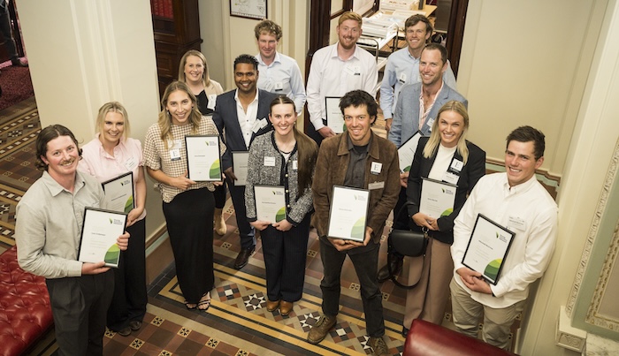 2024 Upskill and Invest scholarship recipients posing with certificates.