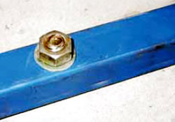 Metal frame fixed to concrete with Dyna-bolt