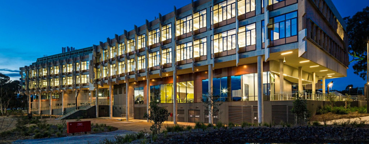 Image shows the outside of a building at night