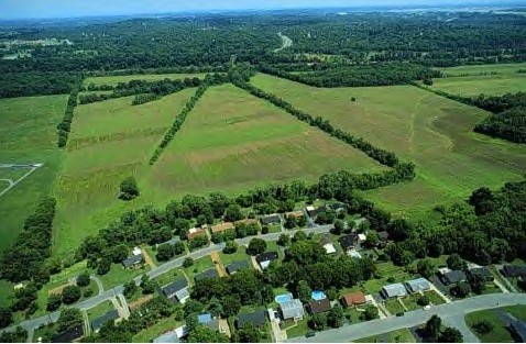 Aerial view of farmland bordering a town